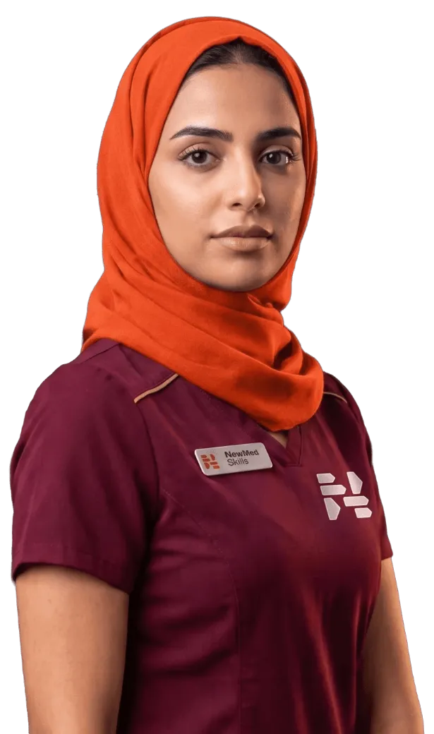 Nurse in maroon NewMedSkills scrubs and a bright orange hijab, looking calmly at the camera