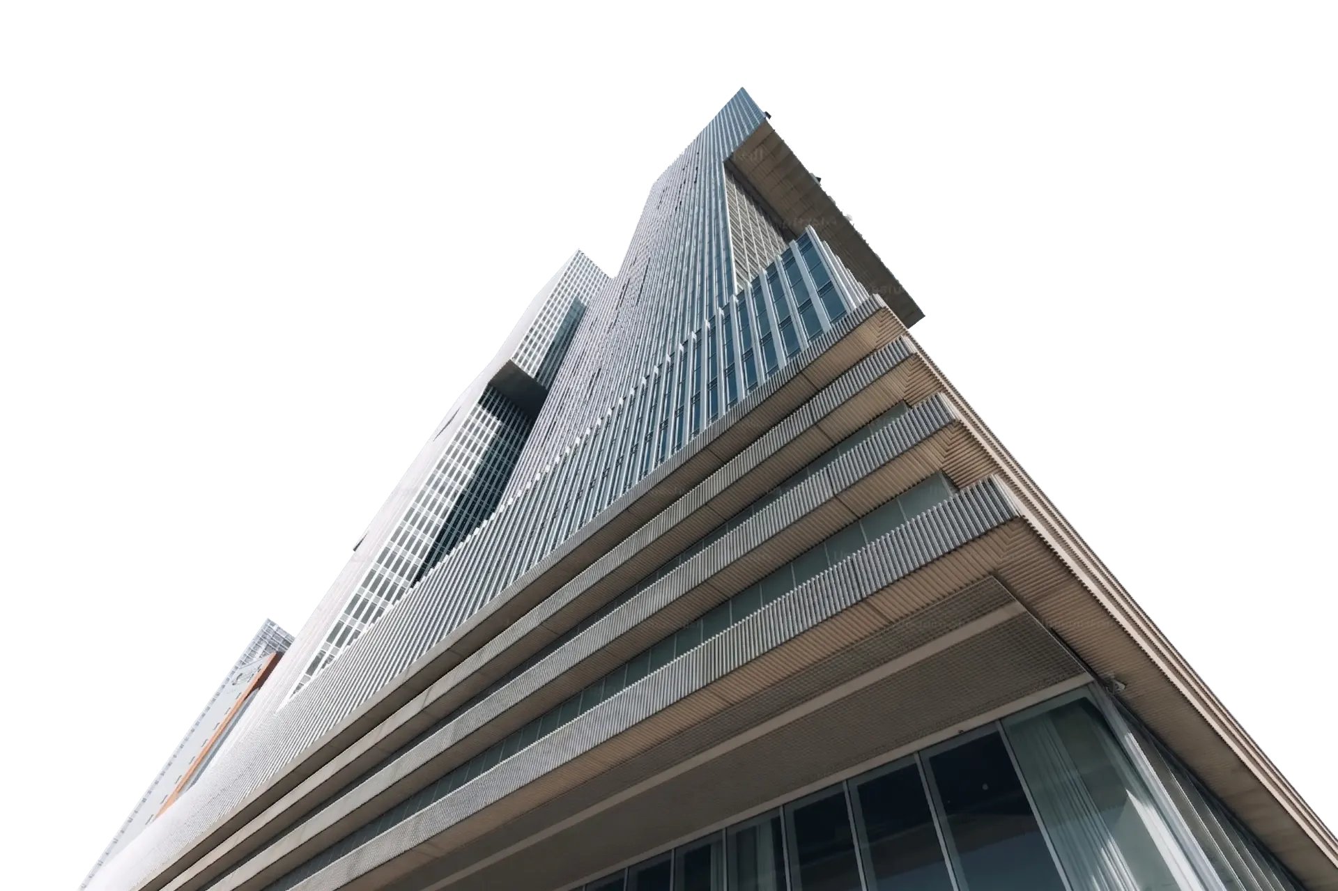 Glass tower rising against the sky, photographed looking straight up from street level